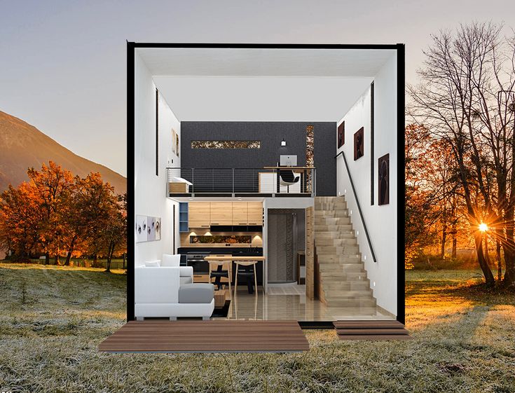 an open living room with stairs leading to the upper floor