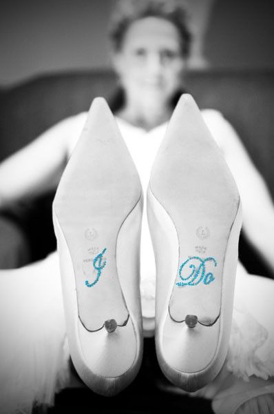 a woman is sitting on a couch with her feet propped up in front of her