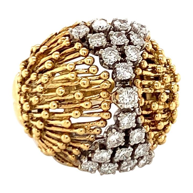 This lovely 1960s diamond dome ring in 18K yellow gold is intricately styled with a distinctive wire and beaded design. Centering 21 round brilliant cut diamonds totaling approximately 1.35 carats, this ring glistens with diamonds of G color and VS-2 clarity, set elegantly within the detailed gold dome. Measuring 22 millimeters across the top portion, this ring is stamped "M18K," authenticating its quality. Sized at 7.25 and weighing 13 grams, it’s a stylish and intricate piece with a charming v Motifs Perler, Estate Rings, Dome Ring, 18k Yellow Gold Ring, Domed Ring, Yellow Gold Ring, Bead Designs, Round Brilliant Cut Diamond, Round Brilliant Cut