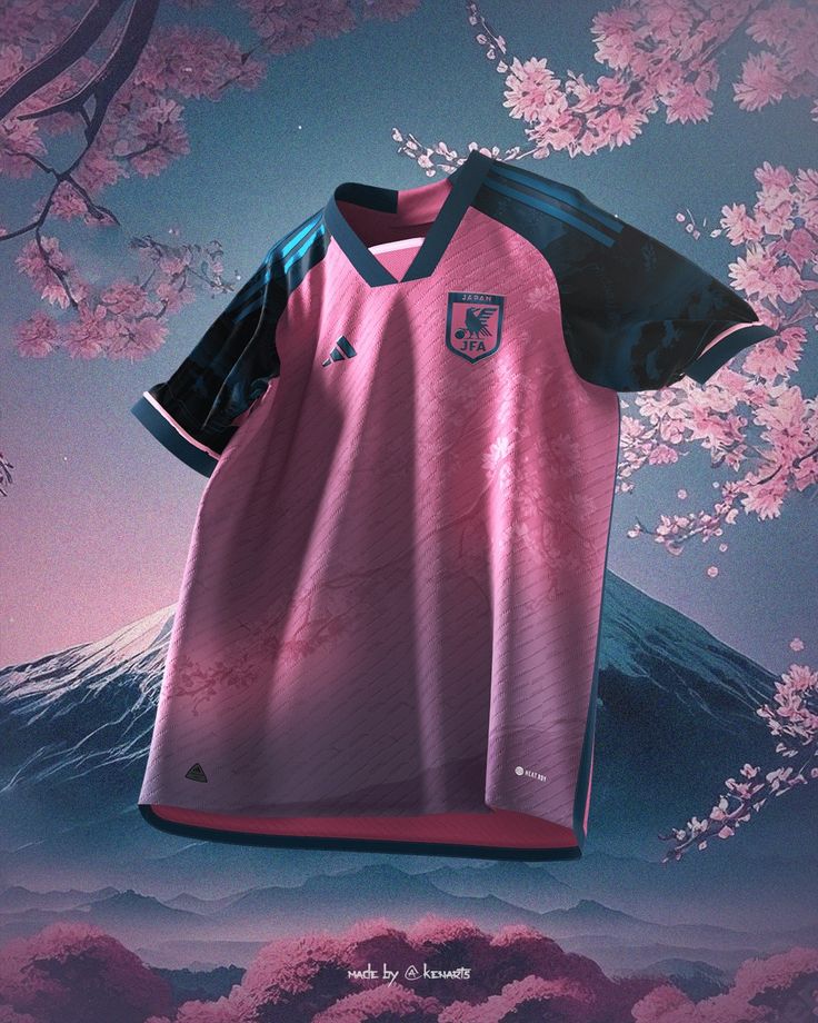 a soccer jersey hanging on a tree with pink flowers in the foreground and an image of a mountain behind it