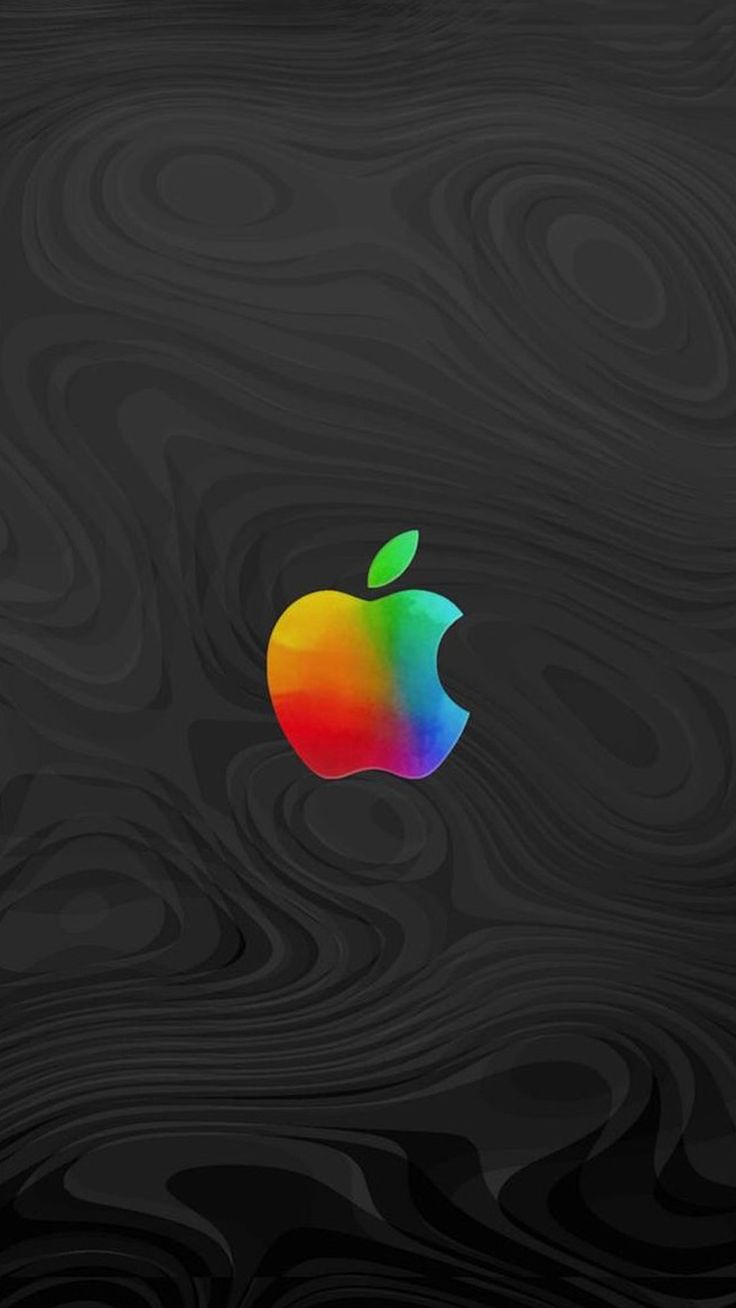 an apple logo is shown on a black wood grained background with the colors of the rainbow