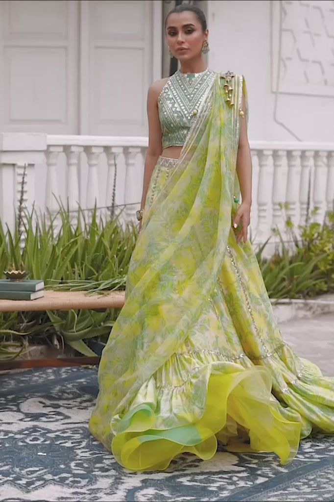 Neha – Sania Maskatiya International Designer Green Dress With Ruffles, Green Silk Anarkali Set For Reception, Green Georgette Saree With Ruffles, Green Silk Sets For Reception, Green Silk Sets With Gota Work, Green Ruffled Pre-draped Saree For Reception, Green Bollywood Sharara With Ruffles, Green Sharara With Gota Work For Reception, Green Georgette Set With Ruffles