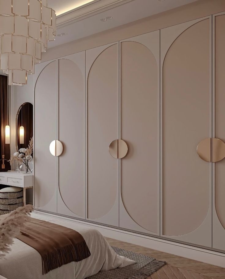 an elegant bedroom with white and beige furniture