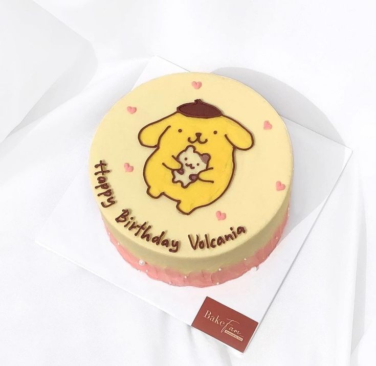 a birthday cake with a teddy bear on it