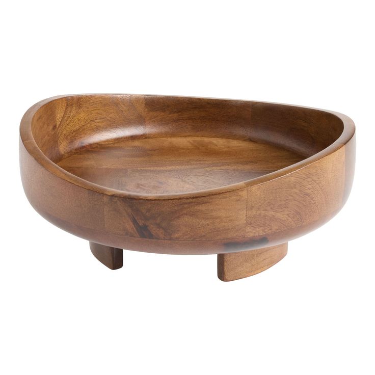 a wooden bowl sitting on top of a table