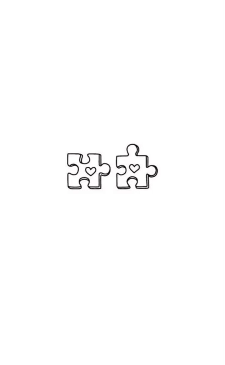 two pieces of puzzle sitting on top of each other