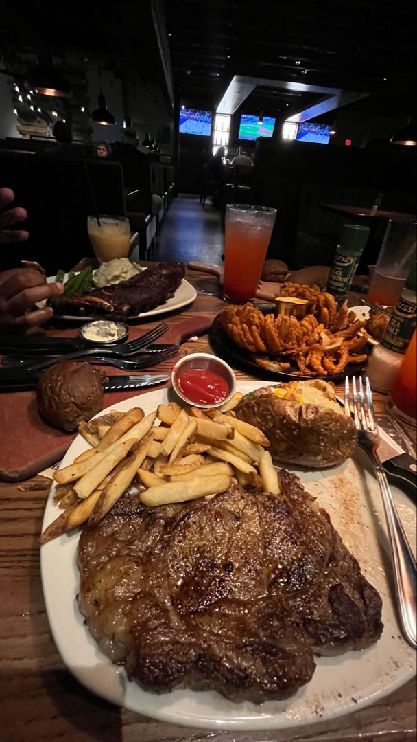 steak and french fries on a white plate