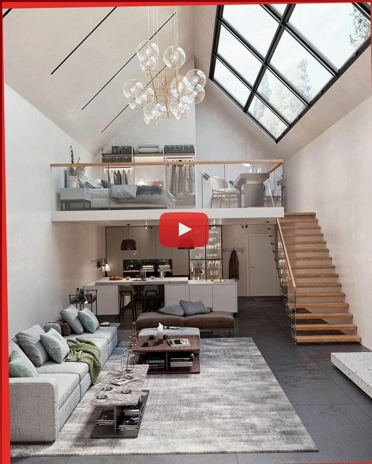 a living room filled with lots of furniture and a stair case in the middle of it