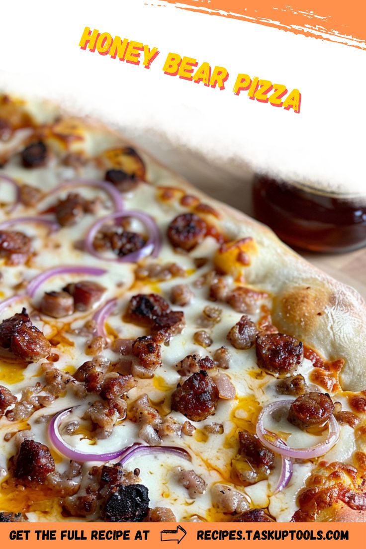 a close up of a pizza with onions and meat toppings on the top, next to a jar of honey bear pizza