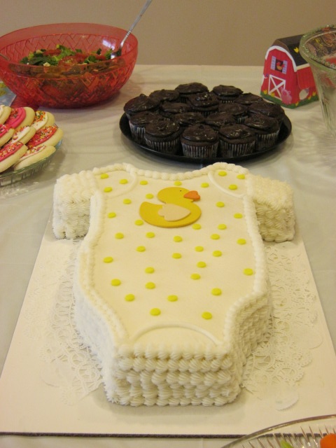 there is a cake that looks like a baby's diaper on the table