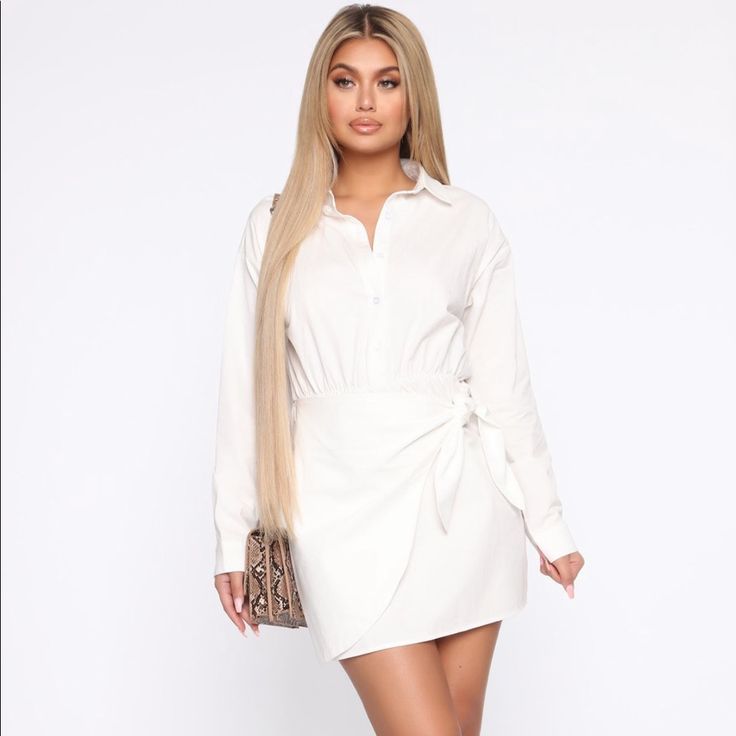 * Poplin Shirt Dress * Wrap Skirt * Long Sleeve * Button Collar Detail * 100% Cotton * Imported Summer Workwear Button-up Mini Skirt, White Button-up Mini Dress For Night Out, Spring Button-up Mini Skirt For Work, Fitted Button-up Mini Skirt For Day Out, Elegant Button-up Mini Skirt For Work, Chic Button-up Mini Skirt For Day Out, Elegant Button-up Mini Skirt For Spring, White Buttoned Mini Skirt For Work, White Button Closure Mini Skirt For Work