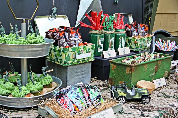 an assortment of green and red items on display at a vendor's market stall