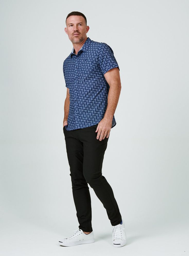 We created the perfect short sleeve button up, with the right mixture of comfort and style, just for you. Our performance shirts have 4-way stretch, are moisture wicking, wrinkle resistant and above all a great new addition to your wardrobe. The performance shirt will be your go-to for any occasion - day to night. This is a shirt that will have you satisfied at any given time. Details Model is 6'1" and wears a size medium. Care: Machine wash cold on delicate cycle with similar colors. Do not use Casual Navy Tops For Golf, Casual Navy Collared Short Sleeve Shirt, Navy Casual Tops For Business Casual, Fitted Short Sleeve Golf Shirt, Casual Short Sleeve Shirt For Business Casual, Casual Cotton Shirt With 4-way Stretch, Navy Business Casual Shirt, Navy Casual Shirt For Business Casual, Casual Cotton Golf Shirt