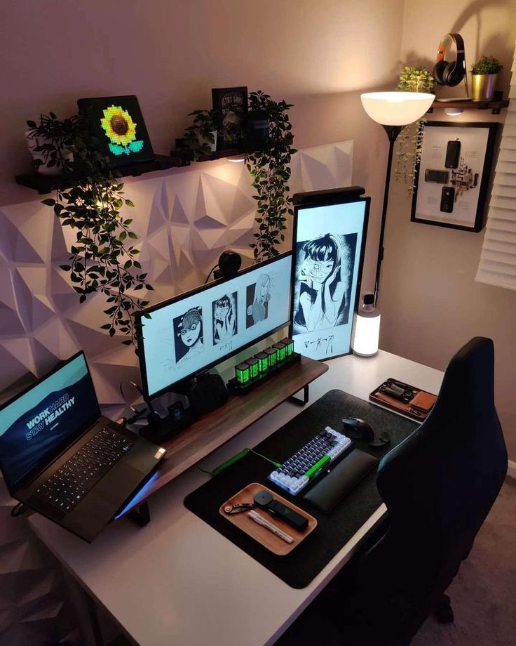 two computer monitors sitting on top of a desk next to a keyboard and mouse pad