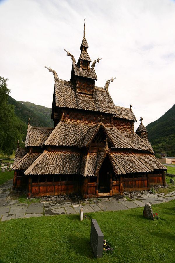 an old wooden church with thatched roof