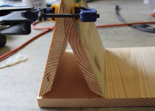 a piece of wood being worked on by a machine