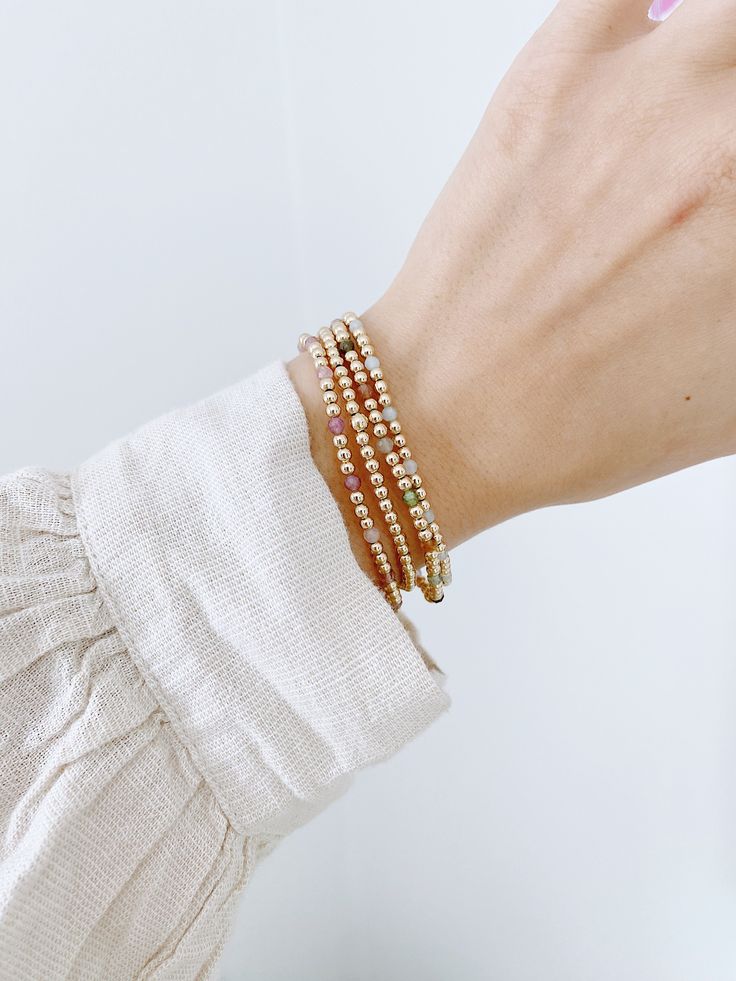 We have teamed up with Simple Joys Shop to bring you a collaboration of premium beaded gold filled wrist wear. These bracelets are created custom to your wrist size. ∙ D E T A I L S ∙ - 3mm bead size- Your choice of beaded gemstone- 18k Gold Filled Beads- Made with strong stretch cord to your custom size! Whats your size? It's super simple to measure. Grab a piece of yarn or flexible fabric and wrap it around your wrist (keep it neutral, not too tight and not too loose). Make a mark on the fabric & measure against a ruler! Always round up if you're between sizes :) ∙ G O L D ∙ F I L L E D ∙ Gold-filled components contain 100+ times more real gold than gold-plated components and are both durable and tarnish resistant. It is more affordable and accessible than solid gold but higher quality t Spiritual Tiny Beads Bracelets, Spiritual Everyday Bracelets With Tiny Beads, Everyday Spiritual Bracelets With Tiny Beads, Gold Beaded Bracelets With Tiny Beads For Everyday, Everyday Tiny Beads Gold Bracelets, Everyday Gold Beaded Bracelets With Tiny Beads, Dainty Beaded Bracelets With Gold Beads For Everyday, Everyday Bracelets With 14k Gold Beads, Dainty Gold Beaded Bracelets For Everyday