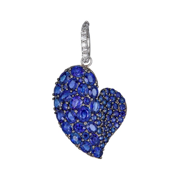 Approx. 7.40 carats Round and Oval Blue Sapphires Approx. 0.10 carats Round Diamonds Pendant is set in 18K White and Black Gold Chain sold separately Luxury Blue Heart Pendant Jewelry, Heart Cut Sapphire Jewelry For Valentine's Day, Sapphire Jewelry For Valentine's Day Formal, Luxury Blue Jewelry For Valentine's Day, Valentine's Day Heart Cut Sapphire Jewelry, Sapphire Fine Jewelry For Valentine's Day, Sapphire Diamond Heart Cut Jewelry, Sapphire Heart Cut Diamond Jewelry, Heart-shaped Sapphire Jewelry With Brilliant Cut