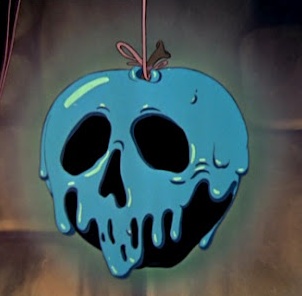 an apple shaped like a skull hanging from a hook