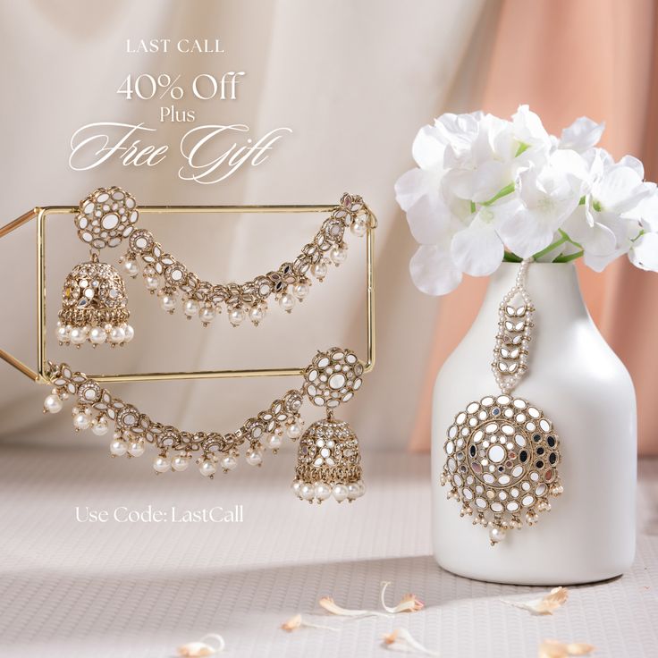 Add a touch of regal splendor to your look with our must-have Vishali Set! A perfect blend of elegance and traditional charm, this earring and maang teekah set is a true testament to the craftsmanship of our skilled artisans. Studded with mirror stones and pearls, this set is designed to complement any ensemble and make a statement wherever you go. Approximate earrings length is 3". Gold-plated on high-quality brass as base metal. Vishali Set (Emerald) is in-stock & ready-to-ship. *Please Note: Elegant Sets With Latkans For Celebration, Elegant Celebration Sets With Latkans, Elegant Kundan Jewelry Set For Navratri, Elegant Ceremonial Tikka For Navratri, Elegant Tikka For Navratri Gift, Elegant Ceremonial Tikka For Diwali, Elegant Ceremonial Tikka For Eid, Eid Celebration Stone Work Tikka, Eid Celebration Jewelry Sets With Latkans