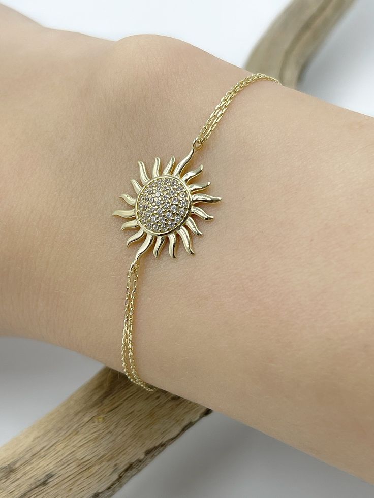 Mini Sun Bracelet, 14K Gold Bracelet, Celestial, Gift for Her, Real Gold Jewelry, Stacking Bracelet, Dainty Chain, Charm Bracelet,  ✪ Handmade / Handcrafted Fine Jewelry  ✪ Gold Weight: Approx. 1.92 g  ✪ Metal:  14K Solid Gold   ✪ Gold Color: White gold, Rose gold, Yellow gold ♡ For questions or special designs, please contact us via message. We are happy to hear from our customers and always respond quickly. Comments are always valuable. 🎁 TRANSPORTATION You can put your choice in the cart, it will be in stock and shipped within 24 hours! . Deliveries are made within 3-5 days. We are not responsible for customs duties incurred during international orders. ☎ Please leave your phone number at the checkout for shipment purposes. 🌎 RETURN POLICY Satisfaction guaranteed! No Hassle, Full refu Gold Sun Bracelet, Gold Sterling Silver Round Tennis Bracelet, Adjustable 14k Gold Bracelet Hallmarked, Adjustable 14k Yellow Gold Diamond Bracelet, Gold Sterling Silver Tennis Bracelet, Gold Sterling Silver Tennis Bracelet Fine Jewelry, Adjustable Yellow Gold Diamond Bracelet In Sterling Silver, Adjustable Yellow Gold Diamond Chain Bracelet, Yellow Gold Sterling Silver Tennis Bracelet As Gift