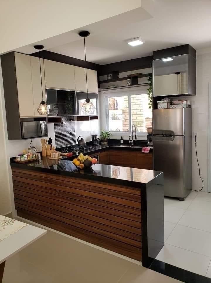 a modern kitchen with stainless steel appliances and wooden counter tops, along with white tile flooring