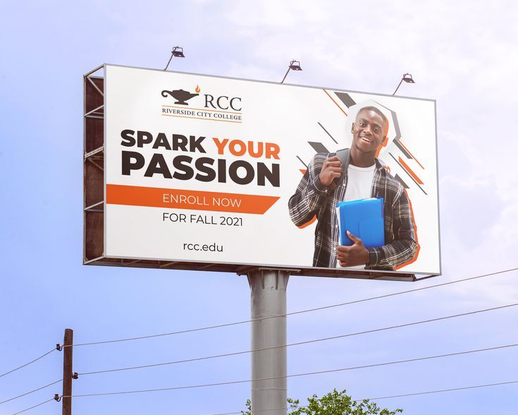 a billboard with a man holding a blue folder in his right hand and the words spark your passion on it