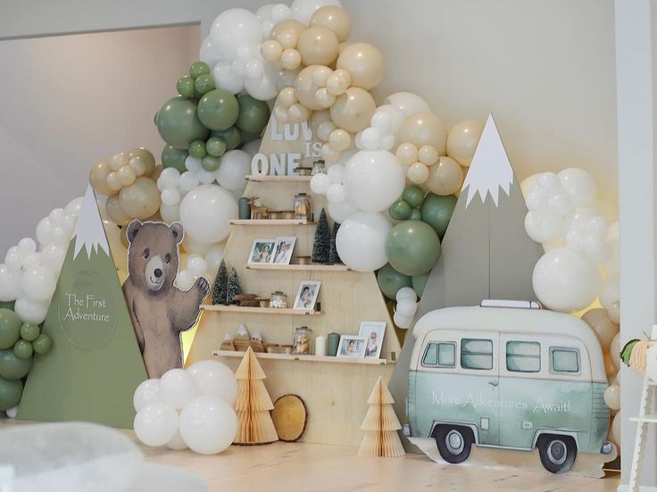 a room filled with balloons and an old vw bus