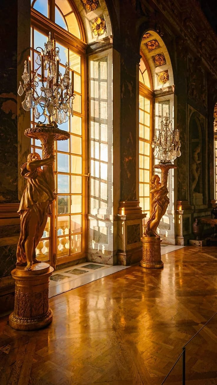 an ornate room with chandeliers and windows