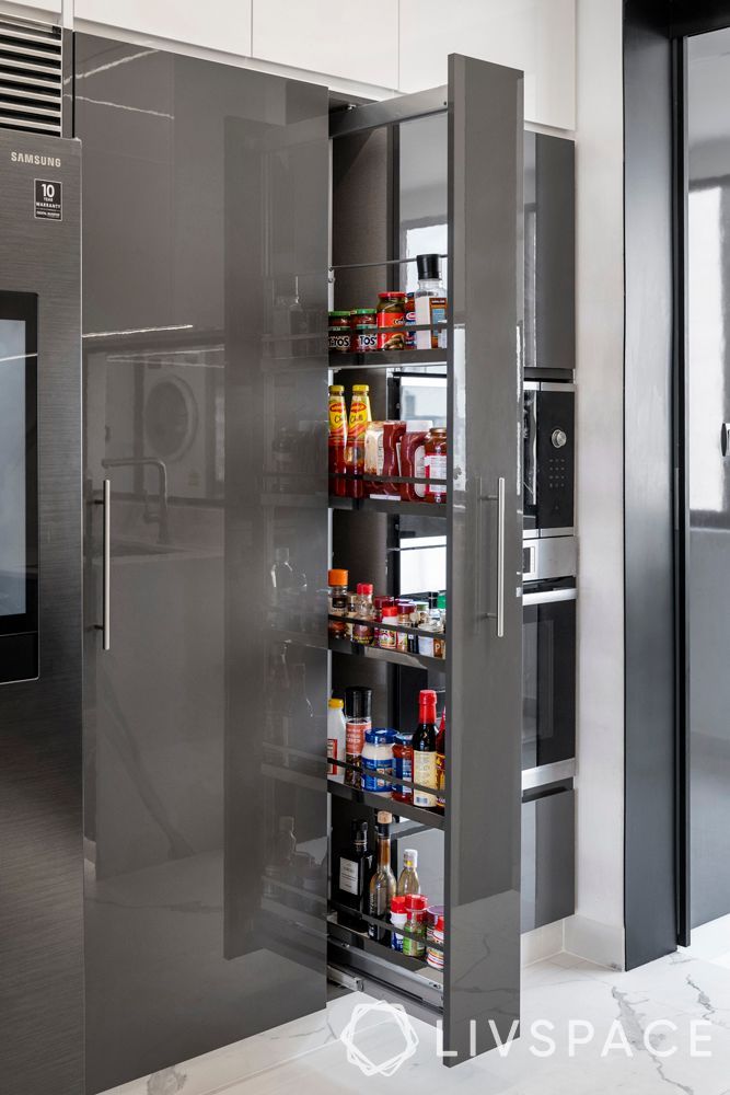 a kitchen with stainless steel appliances and an open pantry in the center, is shown