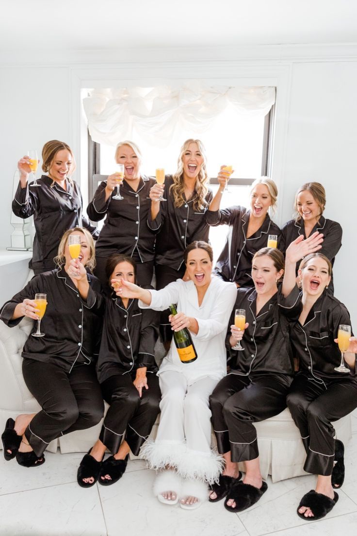 Bride and bridesmaids in silk black and white pajamas popping champagne while getting ready for a winter wedding Pjs Plus Size, Bridesmaids Pajamas, White Bachelorette, Bridesmaid Pajama, Bridesmaid Pictures, Black And White Wedding Theme, Bridal Party Getting Ready, Bridesmaid Pajamas, Winter Bridesmaids