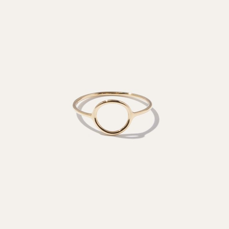 This sleek gold circle ring brings an artful accent to everyday style. Bold enough to wear by itself and minimal enough to compliment a handful of stacked rings. Made in 14k solid gold to stand the test of time. | Women's 14k Circle Ring in Yellow Gold Size 4 | 14k Gold | Quince | Quince | Women's 14k Circle Ring in Yellow Gold, Size 4, 14k Gold Gold Circle Ring, Gold Quince, Stacked Rings, Jewelry Minimal, Gold Circle, Circle Ring, Mom Style, Stacking Rings, Quince