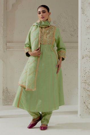 Green padded kalidar cut kurta with floral embroidery on the yoke and sleeves. Paired with a chanderi dogri salwar and embroidered organza dupatta. - Aza Fashions Pista Green Chanderi Churidar With Gota Work, Pista Green Gota Work Churidar In Chanderi, Fitted Chanderi Palazzo Set With Gota Work, Pista Green Straight Kurta With Cutdana, Pista Green Chanderi Churidar For Designer Wear, Designer Pista Green Chanderi Churidar, Chanderi Churidar For Eid Reception, Reception Salwar Kameez With Cutdana In Straight Kurta Style, Fitted Cotton Silk Kurta With Cutdana