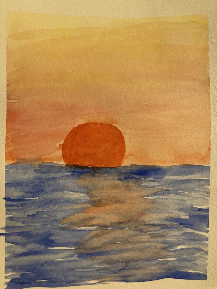 a watercolor painting of an orange ball in the middle of the ocean at sunset