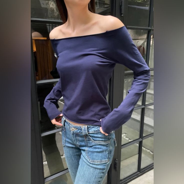 Cotton Blend Off The Shoulder Long-Sleeve Top With A Raw Hem. Fabrics: 96% Cotton, 4% Elastane Measurement: 19"(48 Cm) Length, 18"(46 Cm) Bust Made In: Italy Blue Off-shoulder Top For Fall, Navy Relaxed Fit Tops For Spring, Navy Long Sleeve Summer Top, Navy Fitted Long Sleeve Top, Fitted Long Sleeve Navy Top, Navy Casual Blouse For Fall, Casual Navy Blouse For Fall, Blue Cotton Long Sleeve Top, Navy Chic Fitted Tops