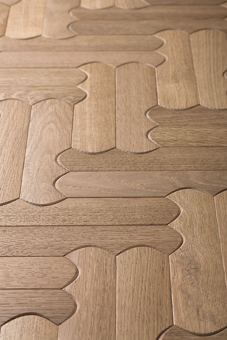 the wood flooring is made up of different shapes and sizes, including an intricate pattern