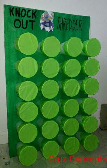 a green bulletin board with lots of circles on it and the words knock out in black