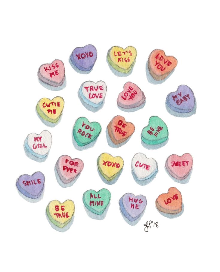 conversation hearts with words written on them in different colors and sizes, arranged in a black frame