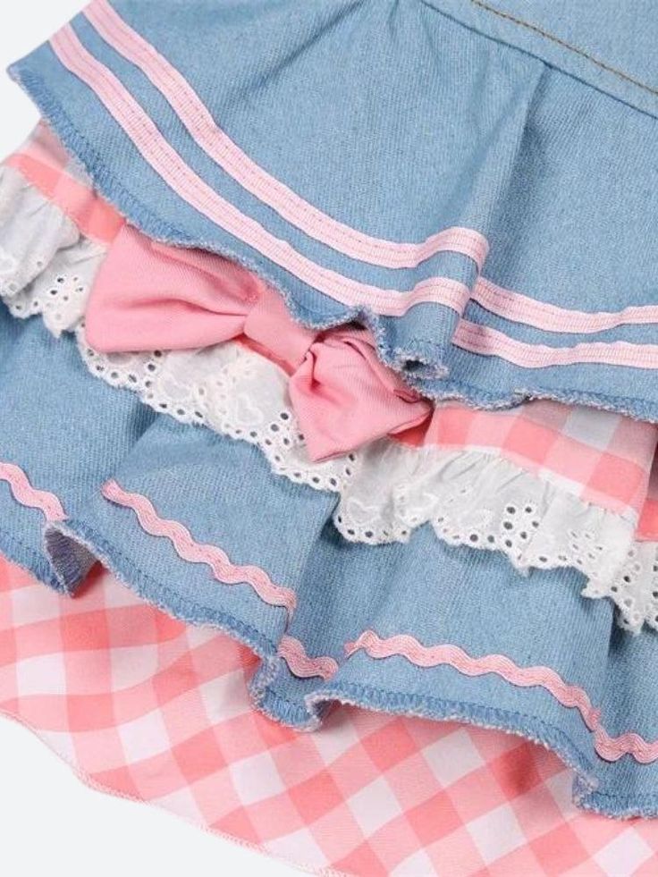 This denim mini skirt captures the kawaii aesthetic with its plaid layers, ruffle design, and heart-shaped plaid detail. Adorned with ribbons, lace, and bows, along with belt loops, it's a playful and stylish piece for casual or streetwear outfits. Kawaii aesthetic Plaid layer details Ruffle design Heart shaped plaid detail at front Ribbon & lace details Bows on skirt Belt loop details A-line Button & zip fastening Double pockets at front Cotton, polyester Cute Blue Denim Skirt, Cute Cotton Tiered Skirt, Cute Tiered Cotton Skirt, Cute Cotton Skirt, Cute Cotton Ruffle Skirt, Cute Cotton Mini Skirt With Ruffles, Cute Cotton Ruffled Skirt, Spring Cute Cotton Denim Skirt, Cute Cotton Skirt With Ruffles