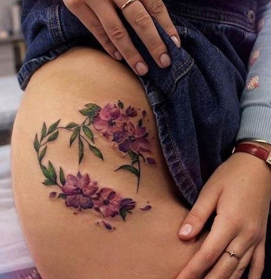 a woman's stomach with flowers on it