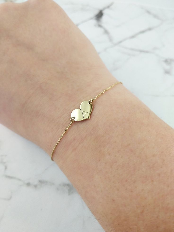 "14K 9K Small heart charm bracelet with Engraved Initial, Solid gold bracelet, Custom Monogram gold bracelet, Personalized gold bracelet, Valentine's Gift, Gift for her, 14K Rose Gold bracelet, Bridesmaid gift, Bridal jewelry, Dainty gold bracelet, FREE EXPRESS SHIPPING Delicate minimalist 14K solid gold bracelet with a small heart charm engraved with one or two initials. A wonderful and thoughtful gift for you and your loved ones! Infinity bracelet: https://www.etsy.com/listing/608986075 Boho e Heart Charm Double Heart Jewelry For Best Friend, Double Heart Charm Jewelry For Best Friend, Personalized 14k Gold Charm Bracelet Gift, Personalized 14k Gold Charm Bracelet For Anniversary, Yellow Gold Charm Bracelet For Valentine's Day Gift, Yellow Gold Charm Bracelet For Mother's Day Gift, Yellow Gold Charm Bracelet Gift For Valentine's Day, 14k Gold Bracelet Gift For Mother's Day, Dainty Yellow Gold Heart Bracelet For Mother's Day