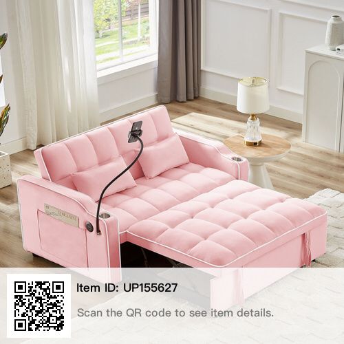 a pink couch sitting on top of a wooden floor