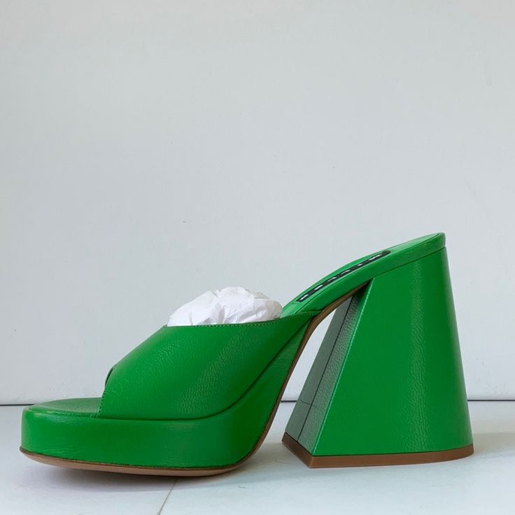 100% Goat Leather Heel Height: 12cm Made In Portugal Made In Portugal Fabric / Material 100% Goat Leather Minor Scuff On One Shoe Un-Worn Nib Green Leather Heels With Reinforced Heel, Chic Green Sandals With 4-inch Heel, Modern Green Mules With Sculpted Heel, Green Open Toe Formal Mules, Green Leather Heels With Sculpted Heel, Green Open Heel Mules For Evening, Chic Green Mules For Formal Occasions, Evening Green Open Heel Mules, Designer High Heel Mules With Sculpted Heel