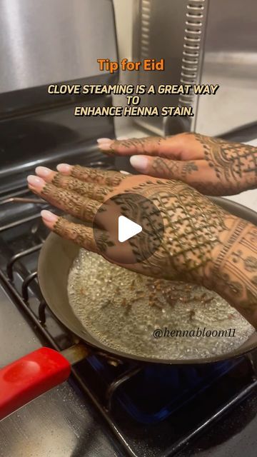 two hands with henna tattoos cooking on top of an open stove burner, and the caption tip for eid