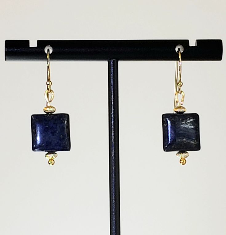 "- Exciting Lapis Lazuli Beaded Gemstone Earrings in a 1/2\" Puff Square design with 14K Gold Filled Corrugated Tiny Saucer Beads and 14K Gold Filled Shepherd (or Bali) Hook Ear Wires. See Photos #1-3. - Deep or Royal Blue shade with hints of Gold flecks. - Accented with 2 14K Gold Filled Saucer Corrugated Beads in 3.5mm x 2.5mm size, top & bottom. - 14K Gold Filled Bali (or Shepherd) Hook Ear Wires with Ball Ends. - See same Earring in 14K Gold Filled Studs or Posts with 4mm Ball Ends and Backs Lapis Lazuli Beads, Gold Caps, Carnelian Beads, Gold Flecks, Rainbow Earrings, Square Bead, Square Design, Beautiful Gift Boxes, Gold Beads