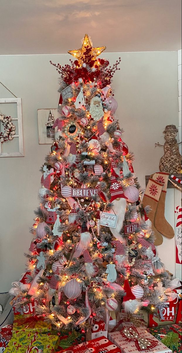 a decorated christmas tree with presents under it