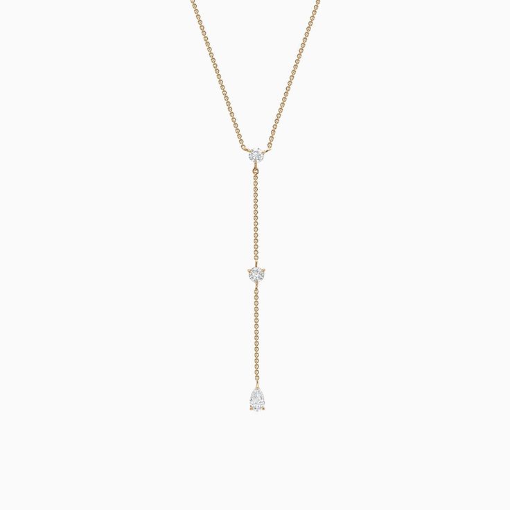 A sight to behold, this Three-Stone Lariat Necklace draws inspiration from the splendour of old-world elegance. Each ethical diamond is adorned with utmost care and attention by Ecksand's team of highly skilled craftspeople for a mesmerizing result that stays true to its promise to last forever. Accent diamonds: 0.65+ ctw, VS2+/F+Chain length: 16/18 in.Chain Type: Diamond Cut TraceClosure: Lobster clasp Lariat Diamond Necklace For Wedding, Fine Jewelry, Elegant Diamond Lariat Necklace With Adjustable Chain, Fine Jewelry Lariat Diamond Necklace For Wedding, Elegant Long Drop Diamond Necklace With Accents, Fine Jewelry Diamond Lariat Necklace For Wedding, Wedding Fine Jewelry Lariat Diamond Necklace, Elegant Long Drop Diamond Lariat Necklace, Wedding Lariat Necklace With Adjustable Diamond Chain, Diamond Lariat Necklace With Long Drop For Wedding