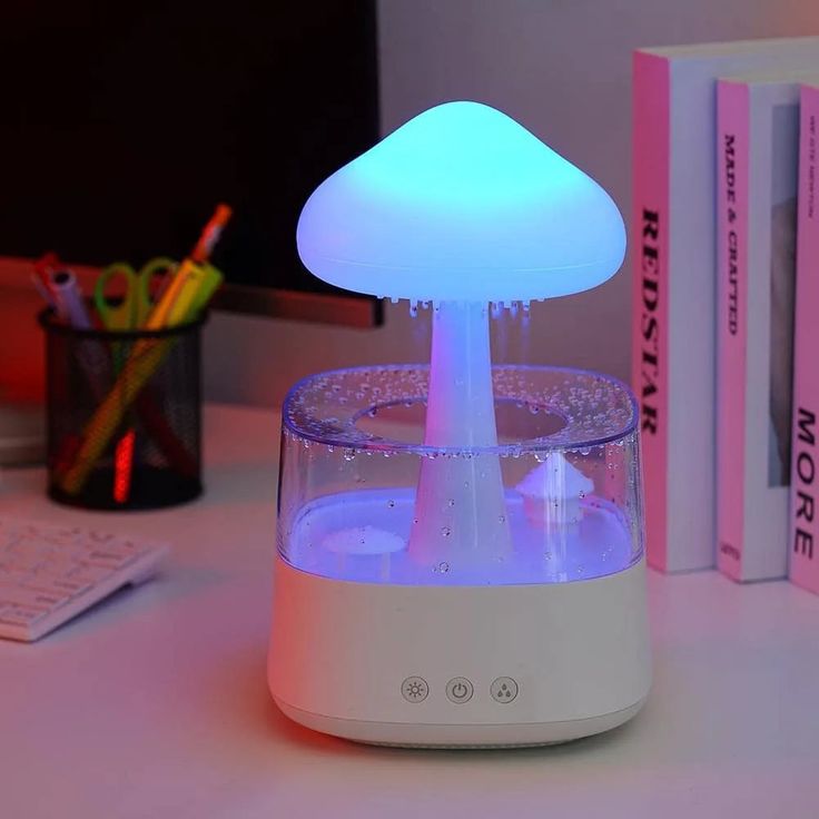 a mushroom shaped light sitting on top of a desk