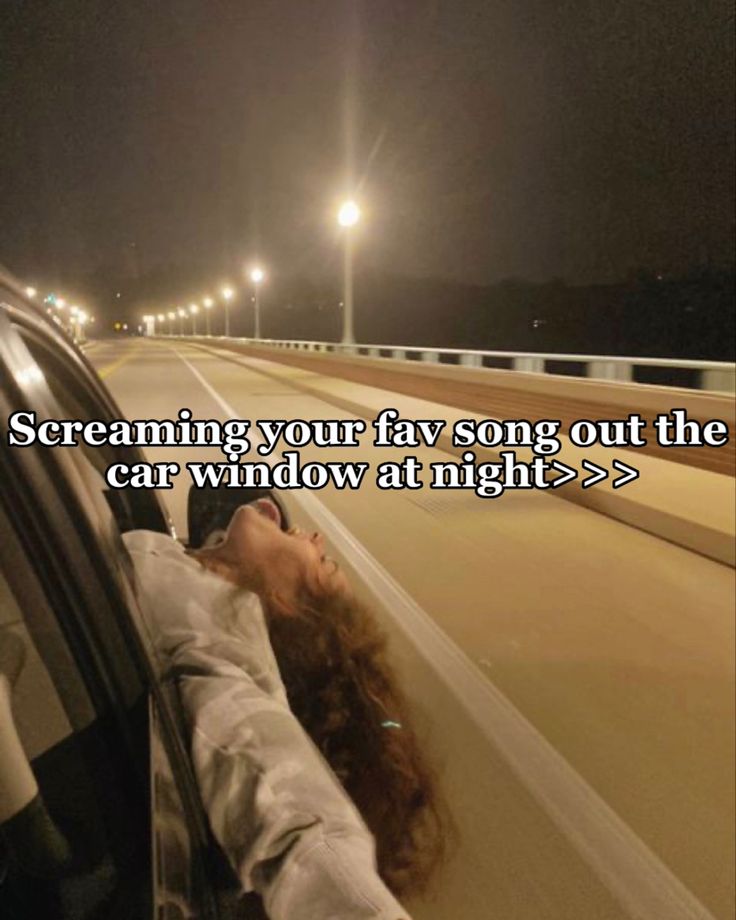 a woman leaning out the window of a car on a highway at night with text overlay