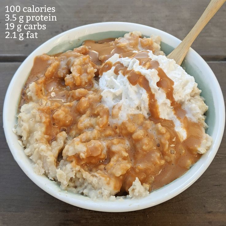 a bowl filled with rice covered in gravy and topped with caramel sauce